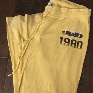 Pink Victoria Secret yellow bell bottom sweatpants